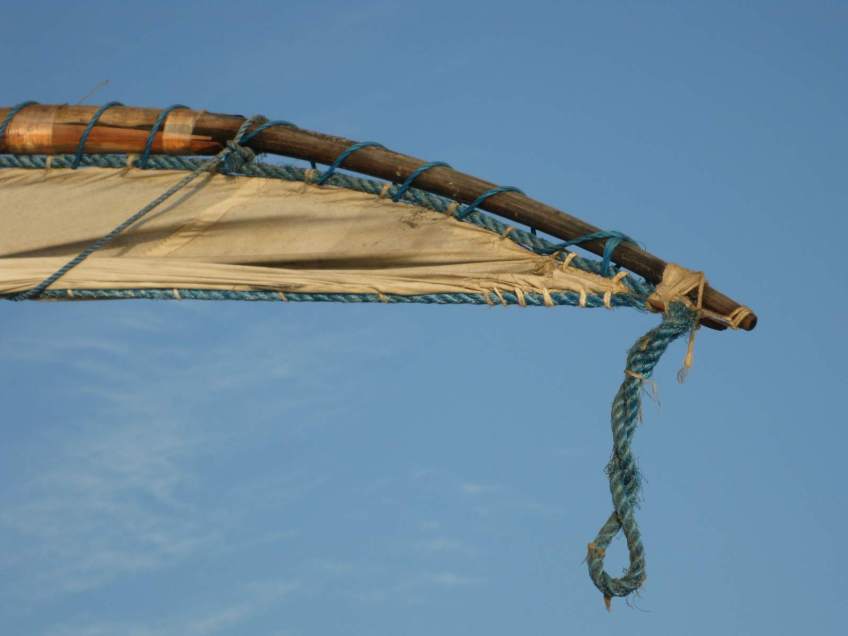 A the head of a jangada's mast with the sail furled.