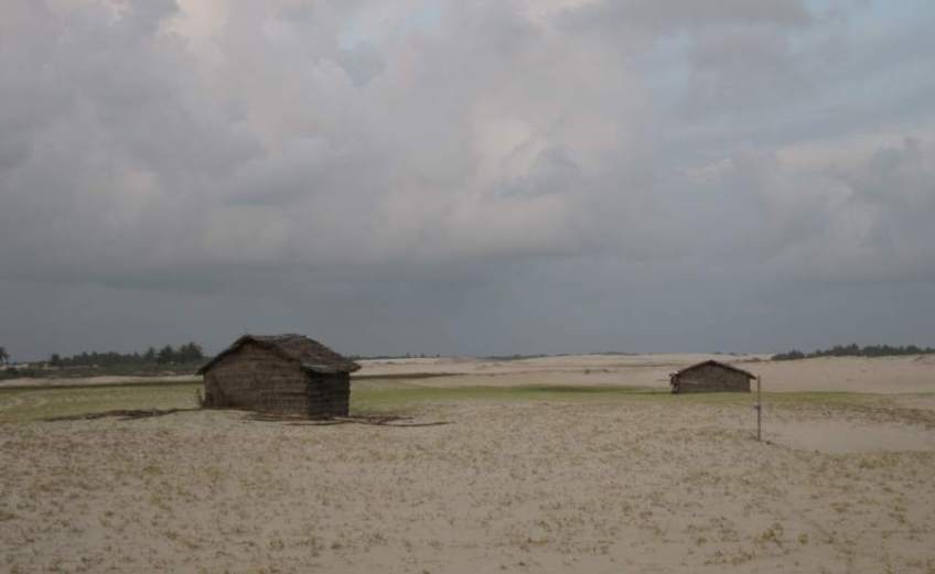 Picture series of two men leaving the beach on a paquete.