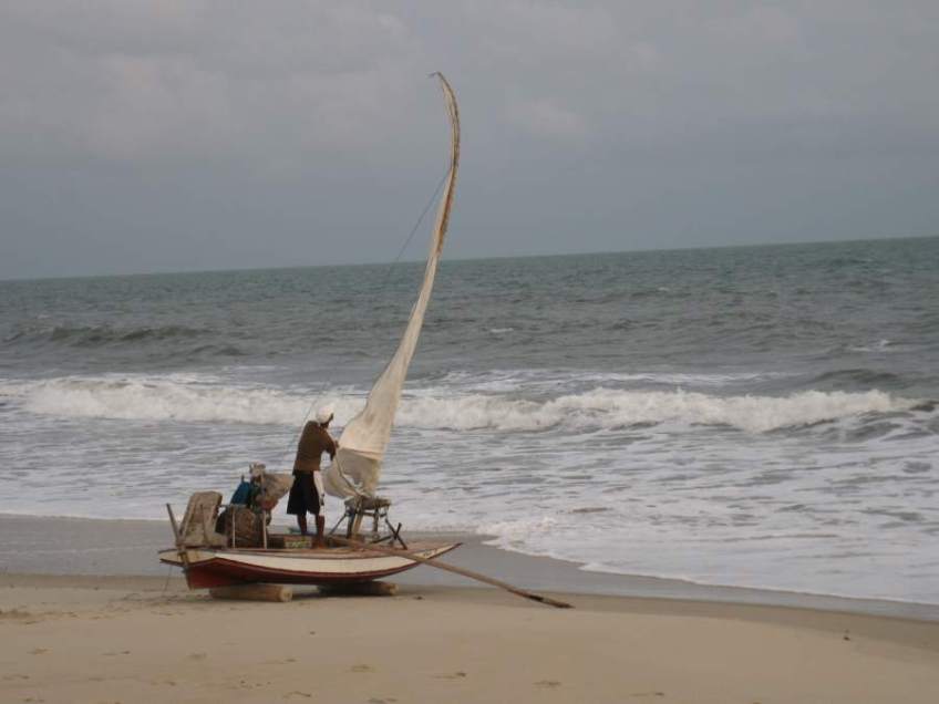 Picture series of two men leaving the beach on a paquete.
