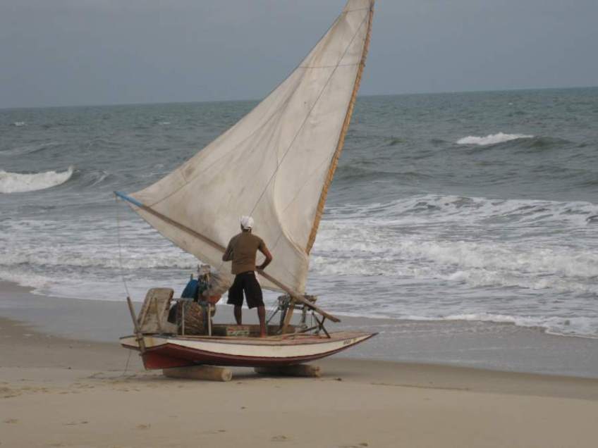Picture series of two men leaving the beach on a paquete.