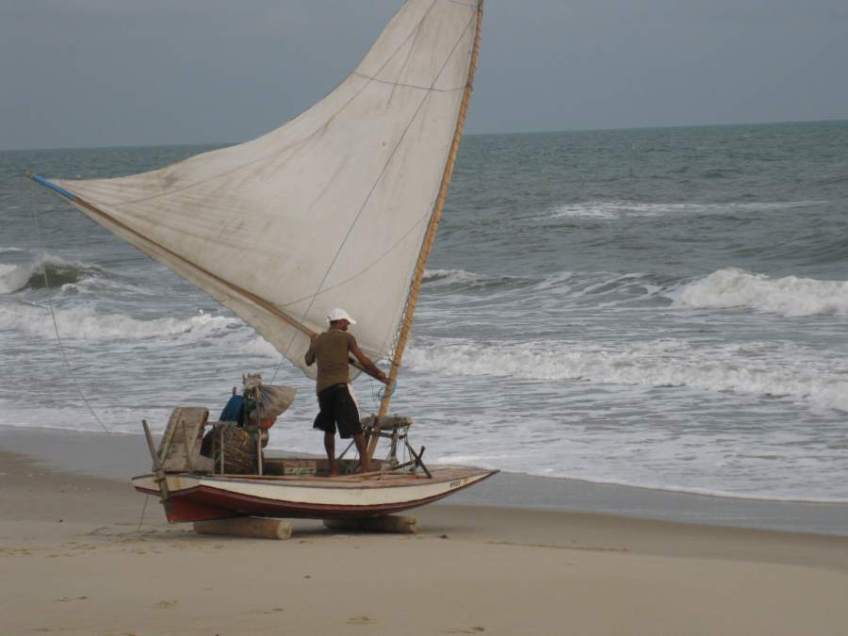 Picture series of two men leaving the beach on a paquete.