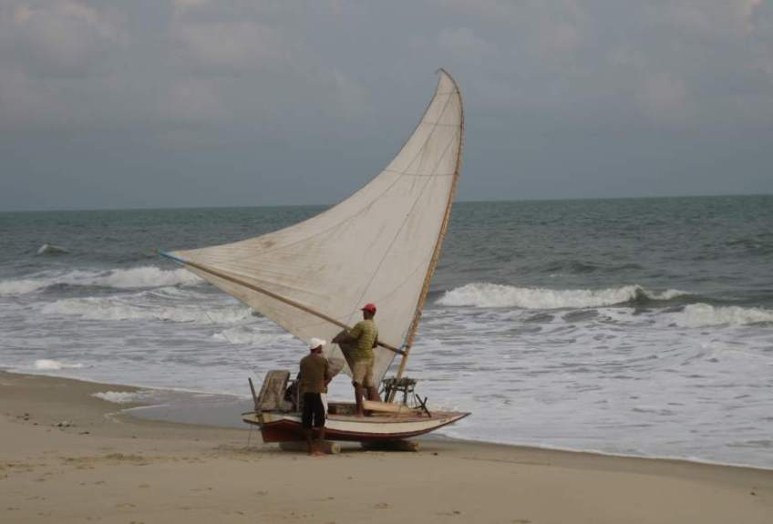 Picture series of two men leaving the beach on a paquete.