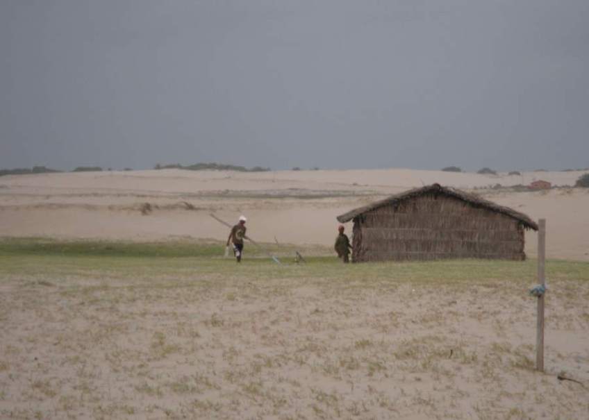 Picture series of two men leaving the beach on a paquete.