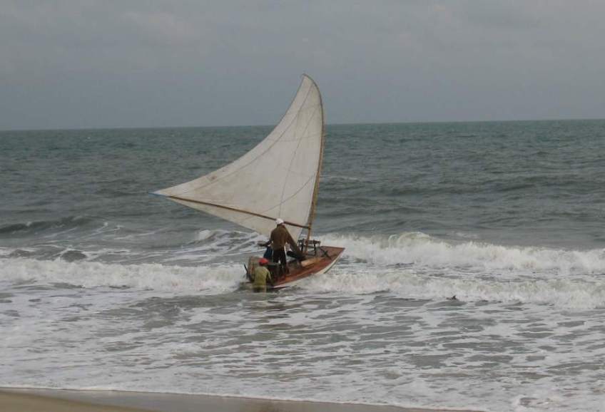 Picture series of two men leaving the beach on a paquete.