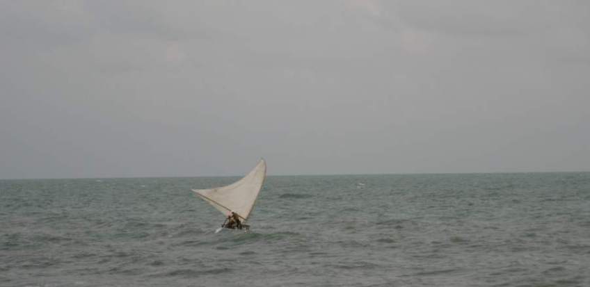 Picture series of two men leaving the beach on a paquete.