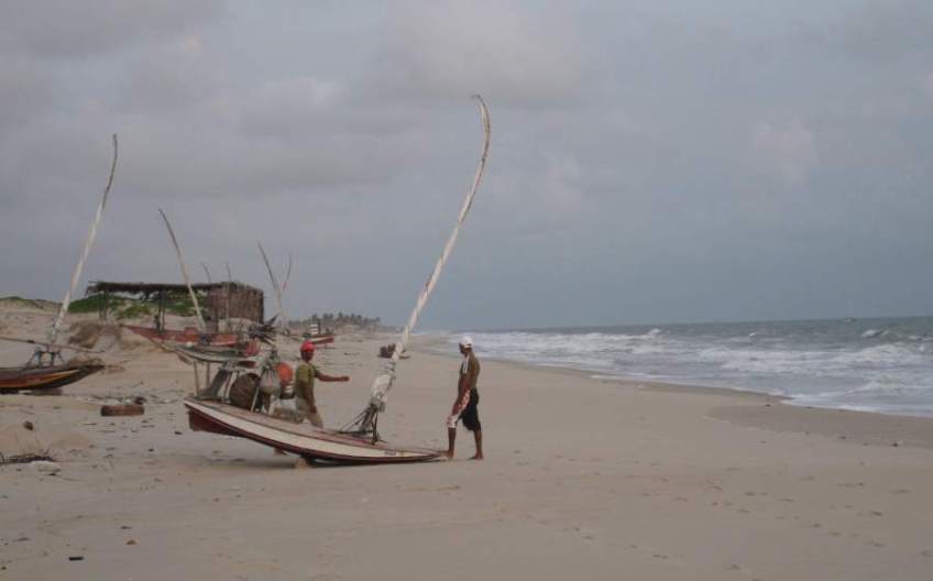 Picture series of two men leaving the beach on a paquete.