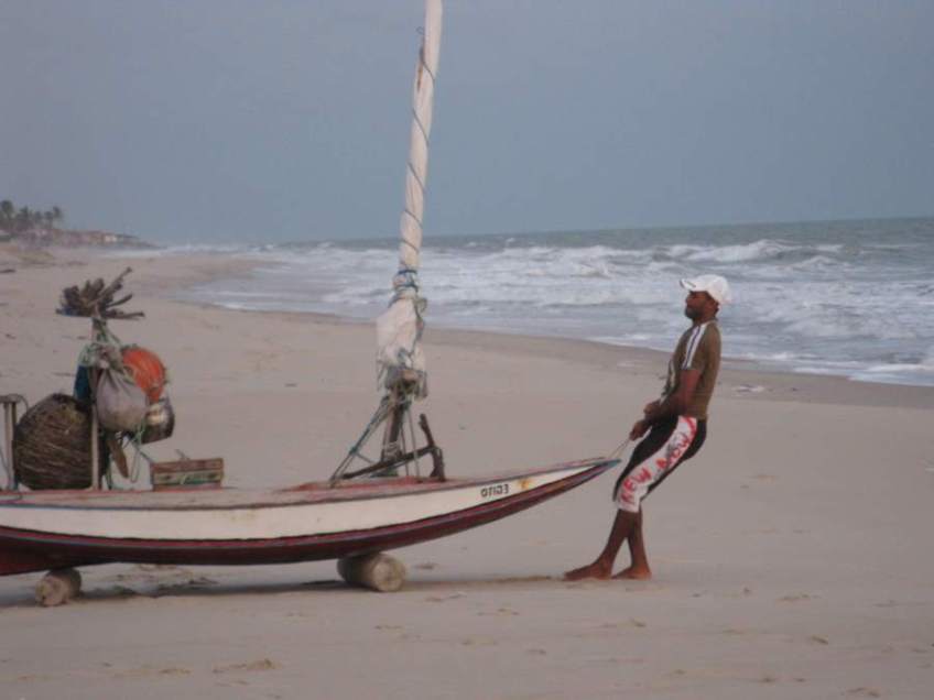 Picture series of two men leaving the beach on a paquete.