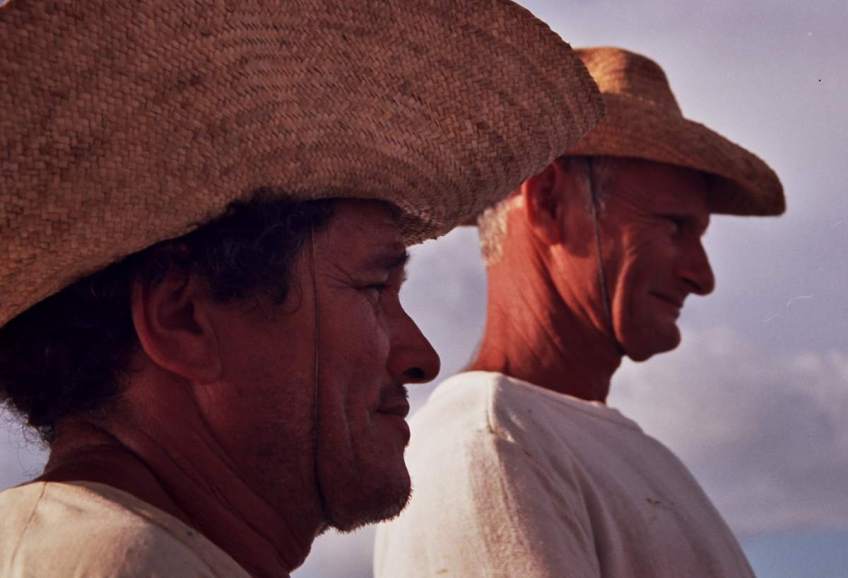 Two jangadeiros standing watch.
